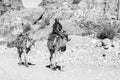 Petra, Jordan Ã¢â¬â December 25, 2015: Bedouin man riding a camel Royalty Free Stock Photo